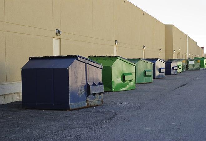 a row of industrial dumpsters for construction waste in Abrams